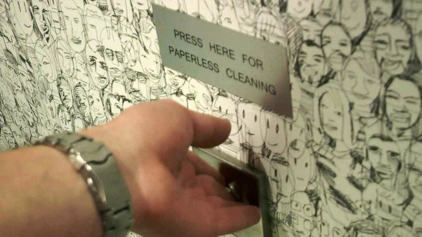 Кнопка в туалете: иллюстрация для статьи об офисе, где сотрудники обходятся без бумаги